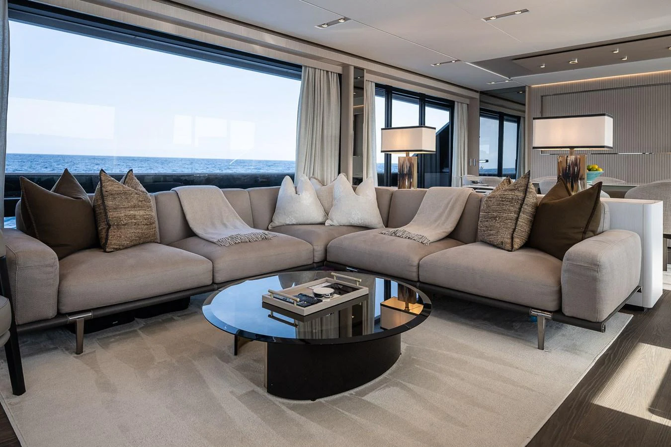 The salon features a spacious and elegant seating area with large windows offering stunning sea views. aboard FREYA Yacht for Sale