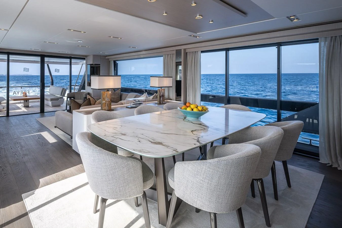 The yacht's dining area offers a luxurious setting with panoramic ocean views and elegant furnishings. aboard FREYA Yacht for Sale