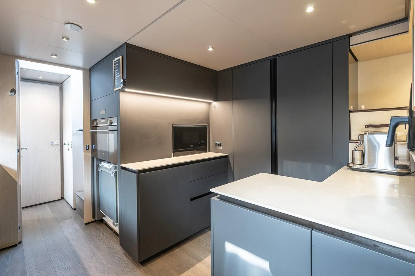 The modern galley features sleek cabinetry and high-end appliances, providing a stylish and functional space for culinary activities. aboard FREYA Yacht for Sale