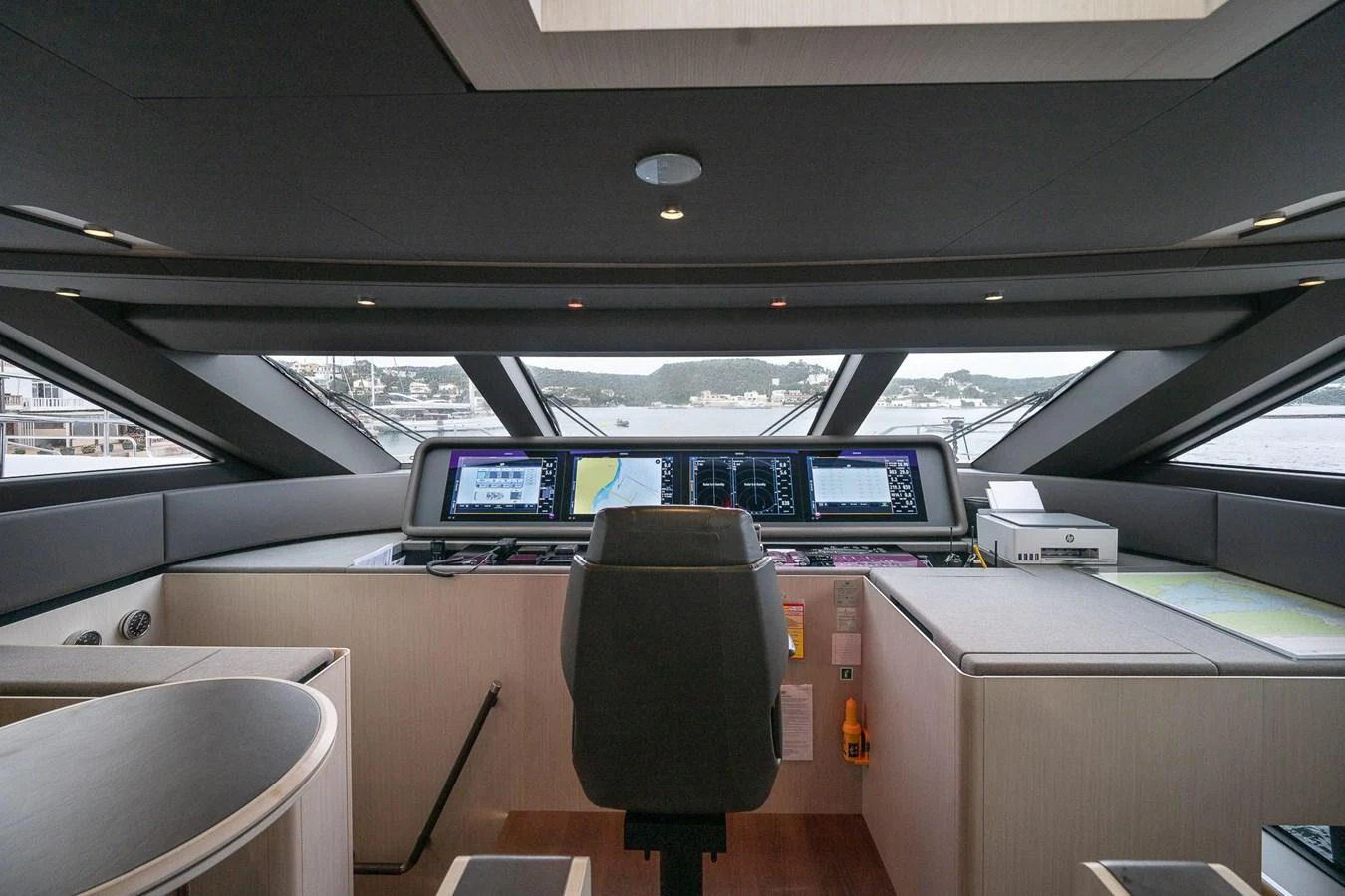 The helm station offers a commanding view with advanced navigation equipment and luxurious finishes. aboard FREYA Yacht for Sale