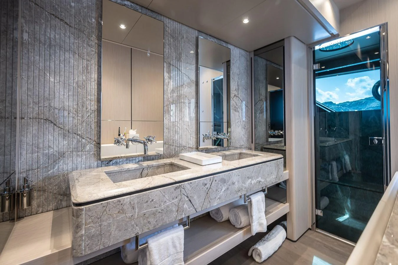 The yacht's bathroom features a luxurious double vanity with marble countertops and modern fixtures. aboard FREYA Yacht for Sale
