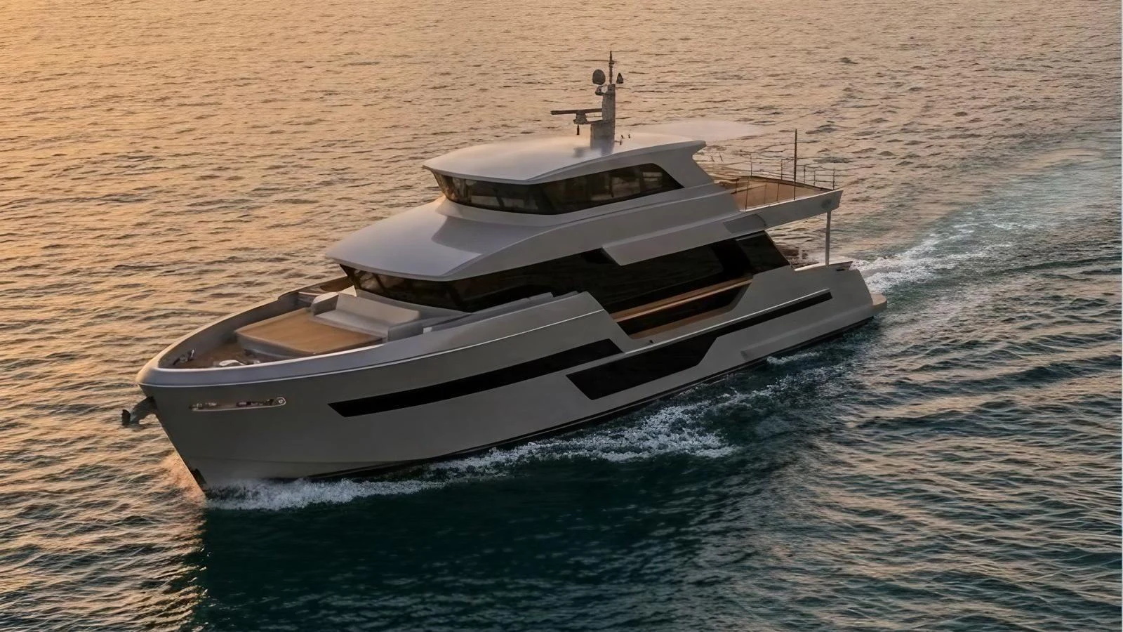 A sleek, modern yacht cruises through calm waters at sunset. aboard ISY 90 EXPLORA Yacht for Sale