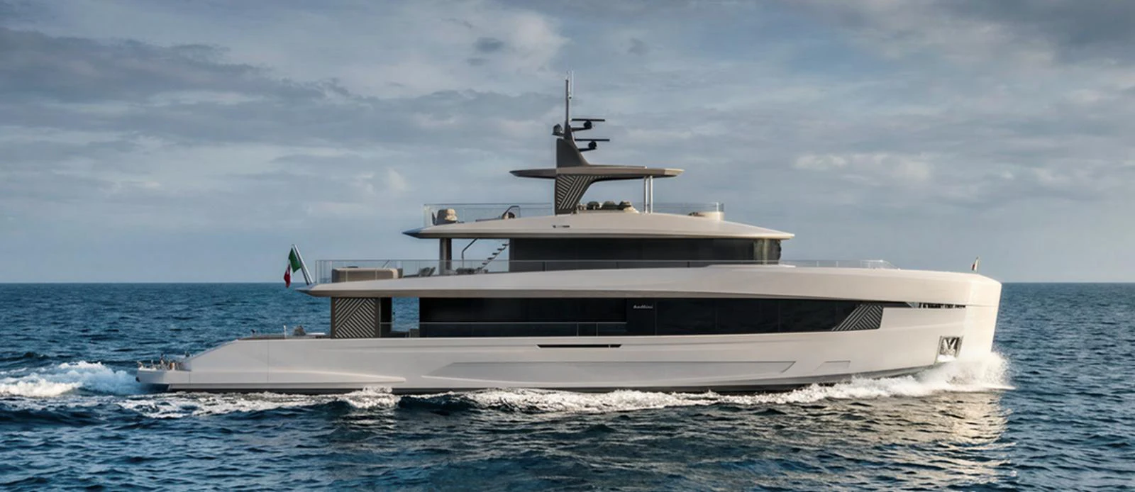 A sleek and modern yacht cruises through the open sea under a cloudy sky. aboard ETERNAL Yacht for Sale