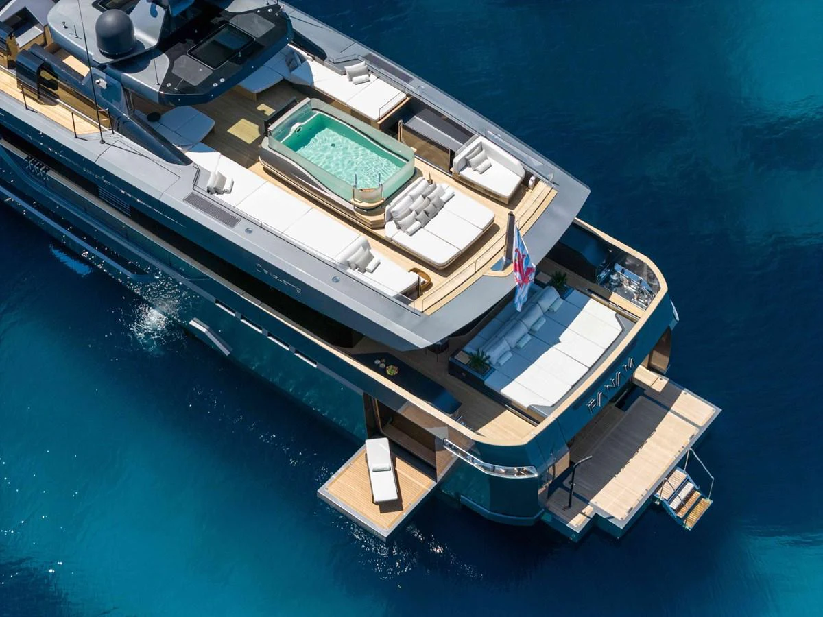 The yacht features a luxurious sundeck with a pool and ample lounging areas, perfect for relaxation. aboard PANAM Yacht for Sale