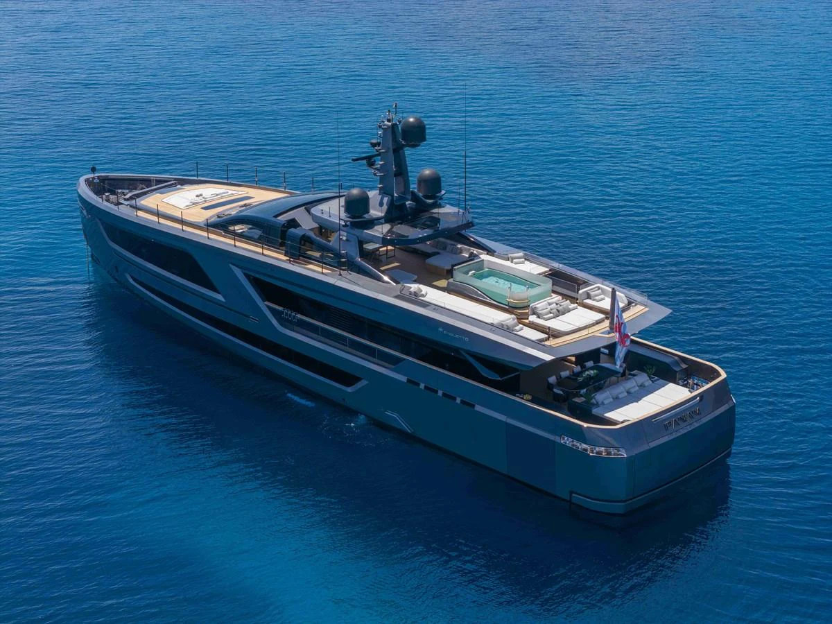 A sleek and modern yacht glides gracefully on calm blue waters, showcasing its luxurious amenities and stylish design. aboard PANAM Yacht for Sale