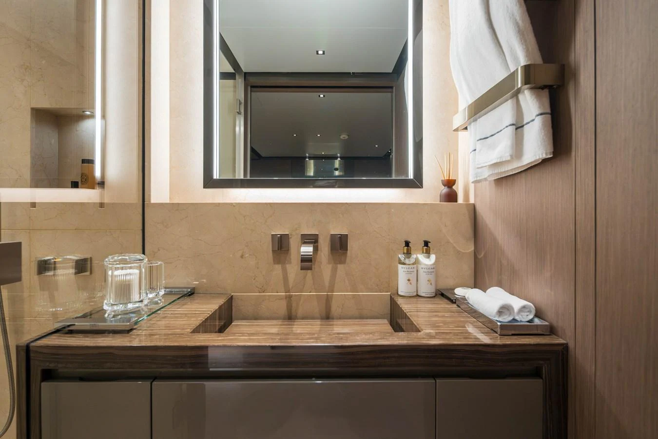 The bathroom features a modern sink with elegant fixtures and luxurious amenities. aboard PANAM Yacht for Sale