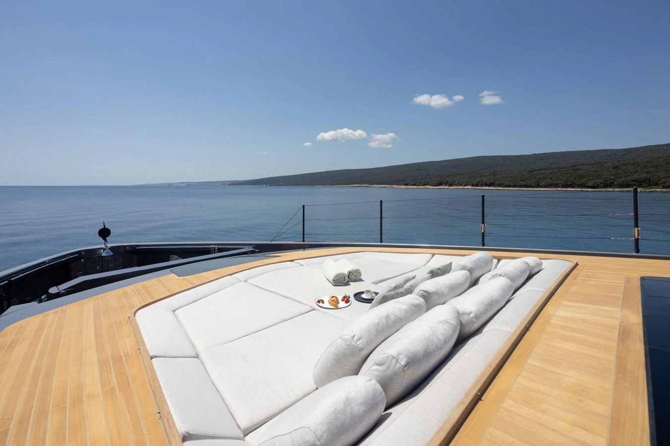 The sundeck offers a luxurious lounging area with plush cushions and stunning sea views. aboard PANAM Yacht for Sale