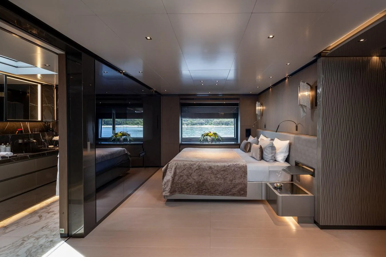 The master stateroom exudes luxury with its spacious layout and elegant design. aboard PANAM Yacht for Sale