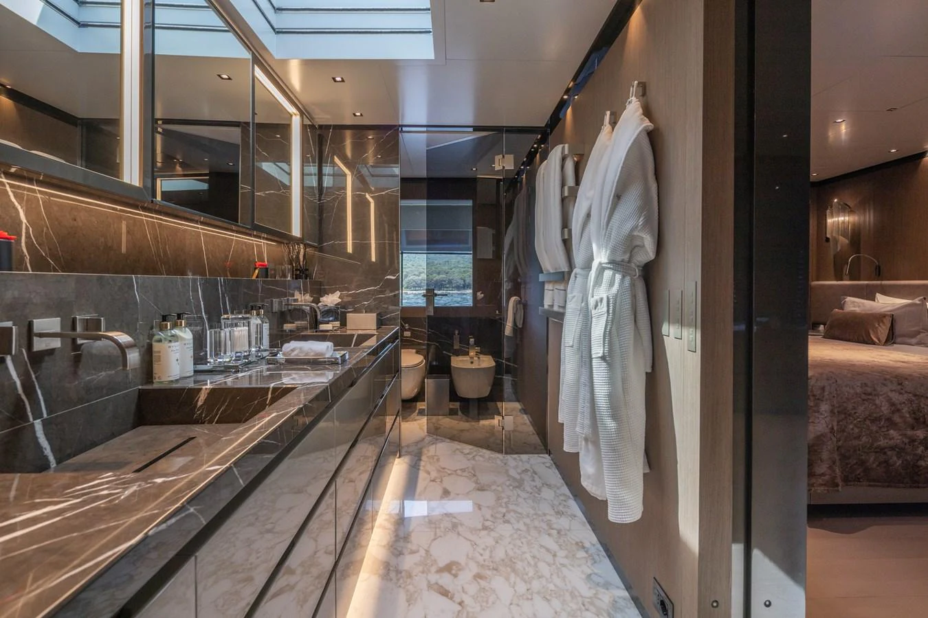 The luxurious bathroom features elegant marble surfaces and modern fixtures. aboard PANAM Yacht for Sale