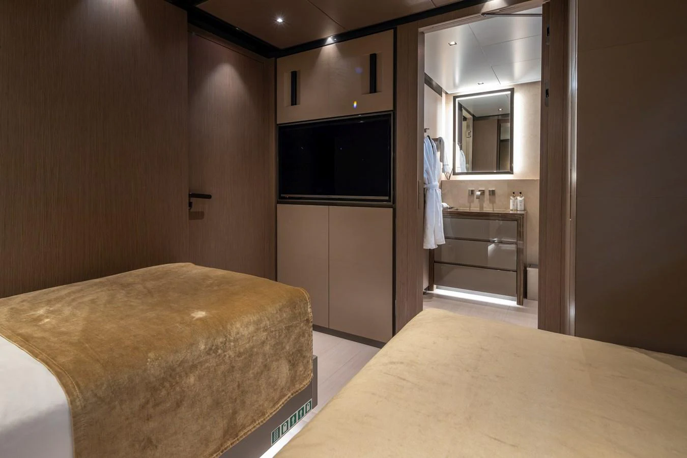 The guest stateroom features twin beds and a private ensuite bathroom, offering a cozy and elegant retreat. aboard PANAM Yacht for Sale