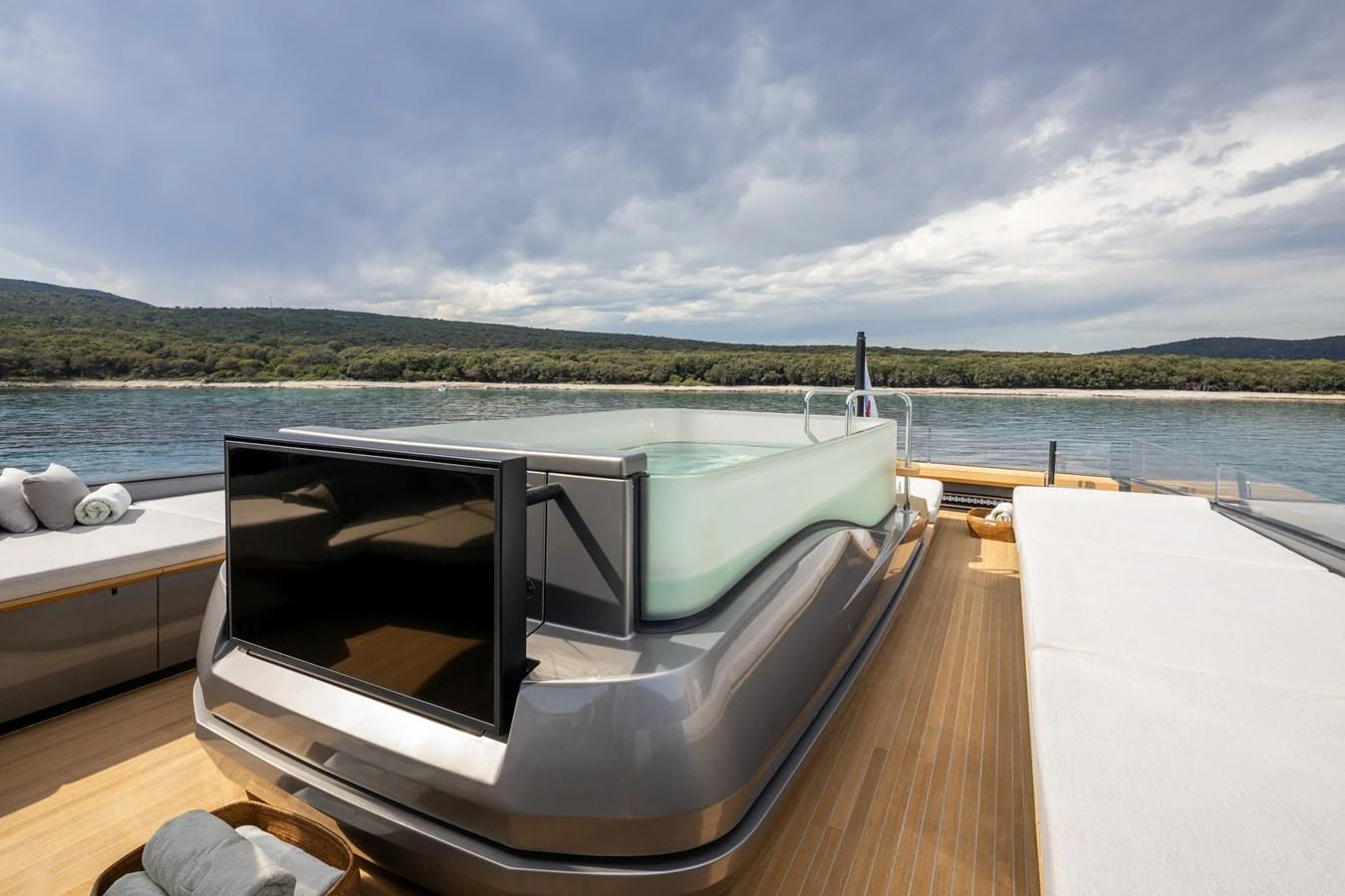 The sundeck features a luxurious hot tub with a scenic view of the water. aboard PANAM Yacht for Sale