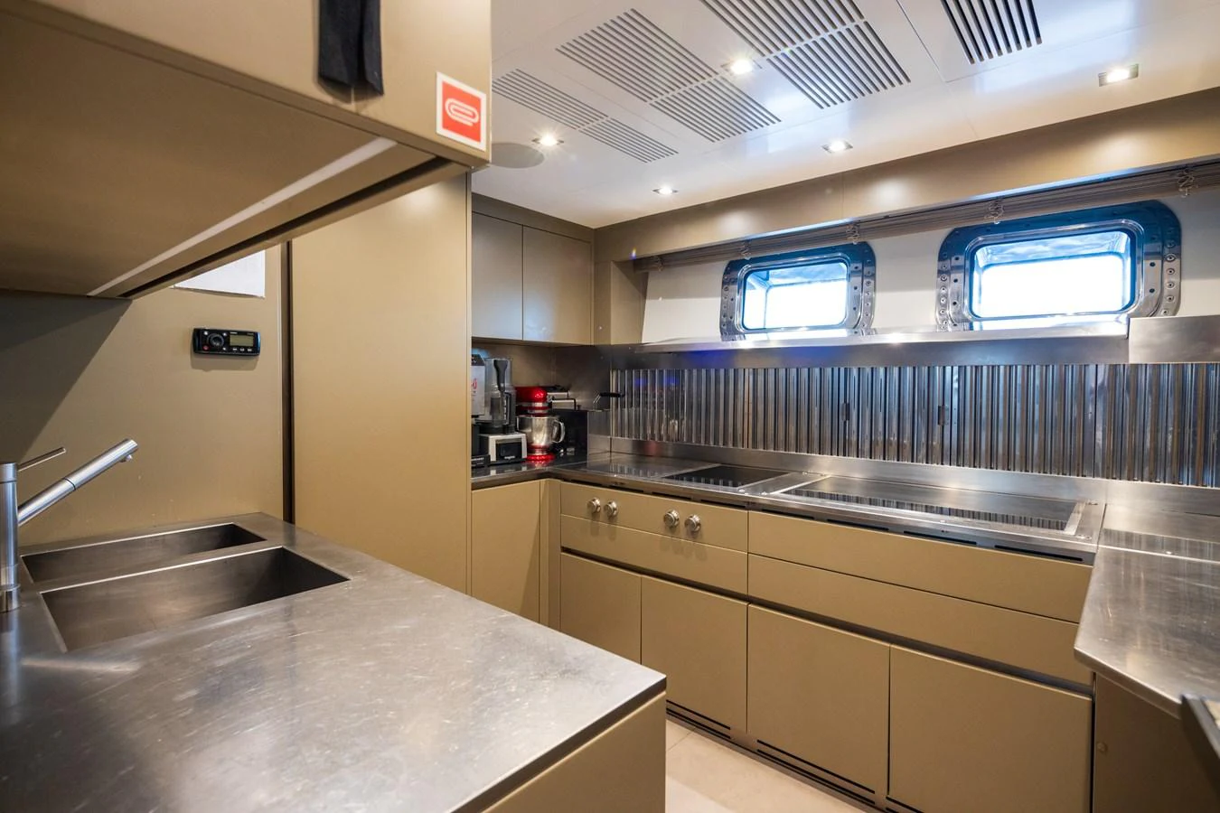 The yacht's galley is equipped with modern appliances and ample counter space, perfect for gourmet meal preparation. aboard PANAM Yacht for Sale