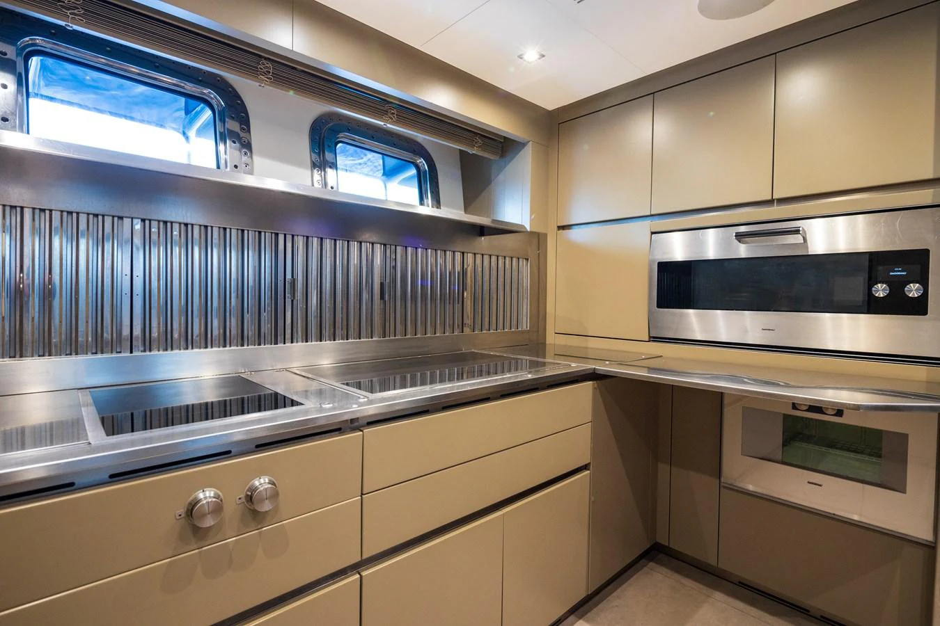 The yacht's galley features modern appliances and sleek cabinetry, perfect for gourmet meal preparation. aboard PANAM Yacht for Sale