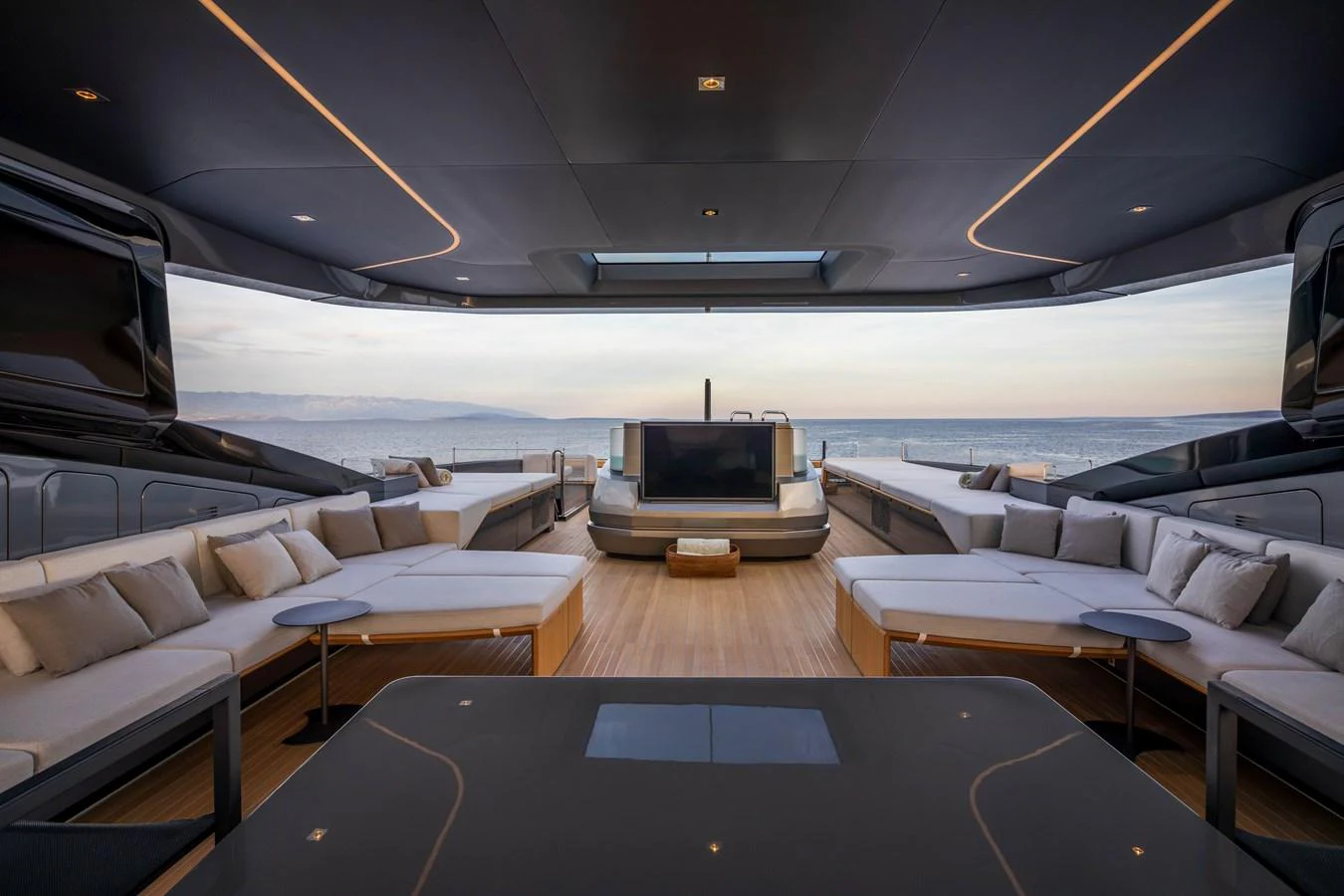 The aft deck offers a luxurious lounging area with panoramic ocean views. aboard PANAM Yacht for Sale