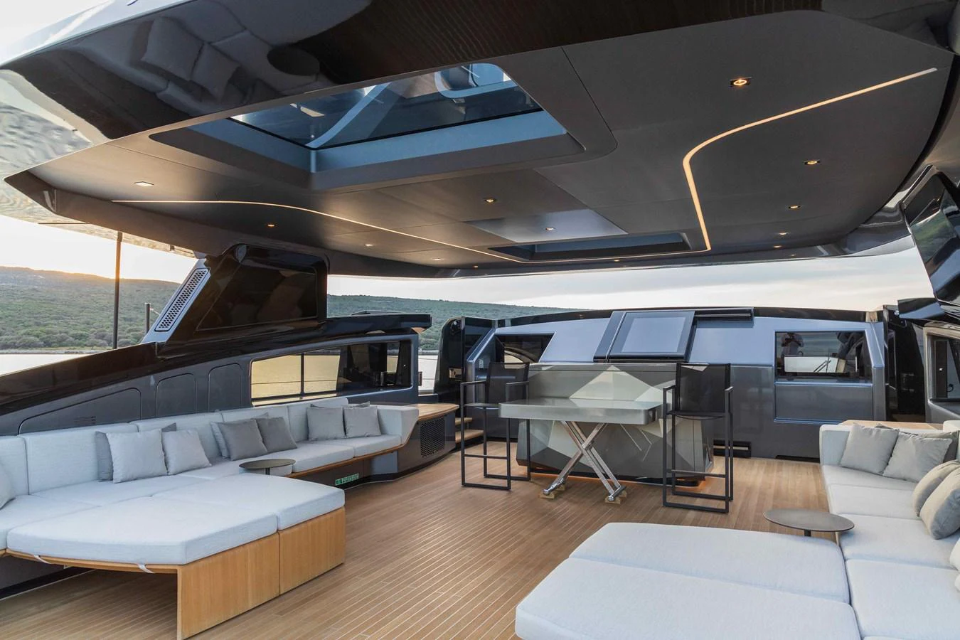 The aft deck features a spacious and modern seating area with sleek furnishings and a sophisticated design. aboard PANAM Yacht for Sale