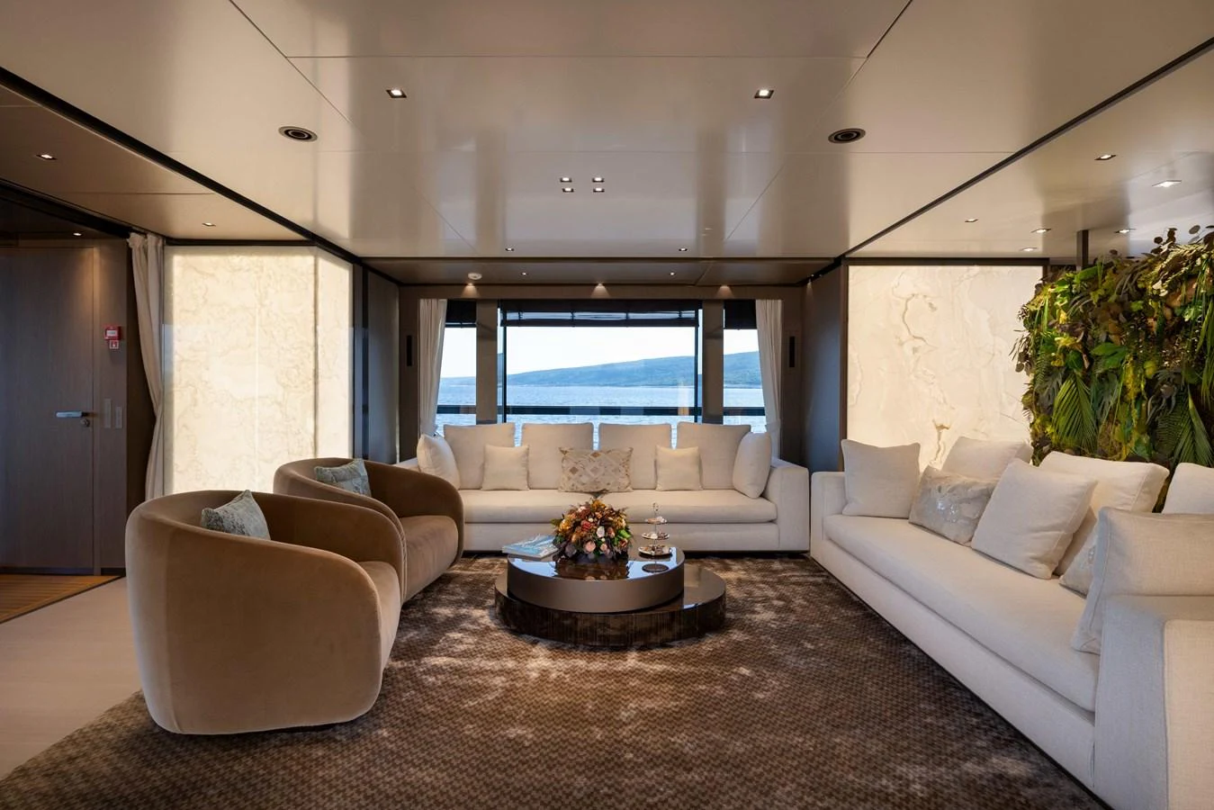 The salon offers a luxurious and comfortable seating area with a stunning view of the sea. aboard PANAM Yacht for Sale