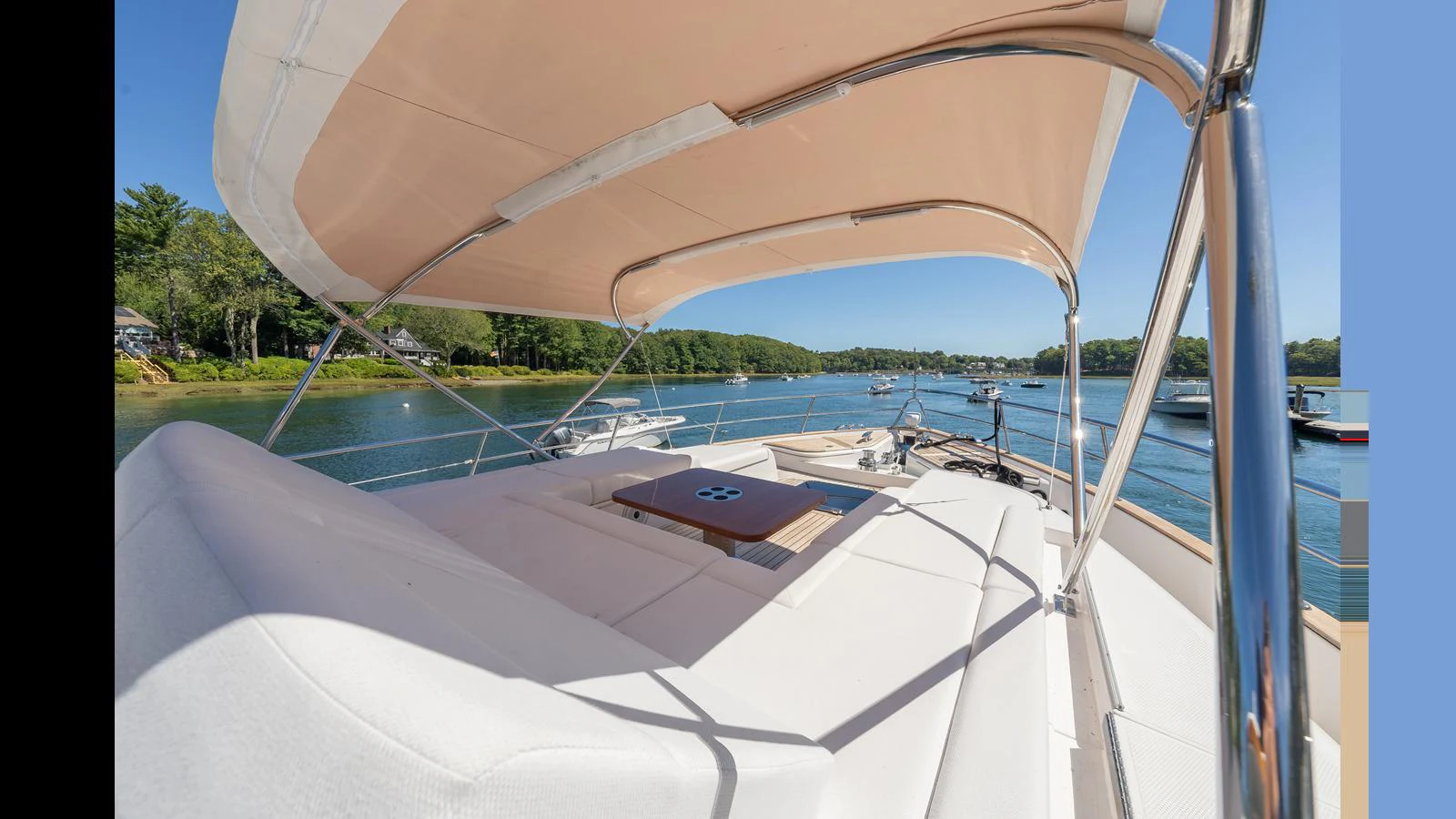 The flybridge offers a spacious and comfortable lounging area with a stunning view of the water. aboard LYRICA Yacht for Sale