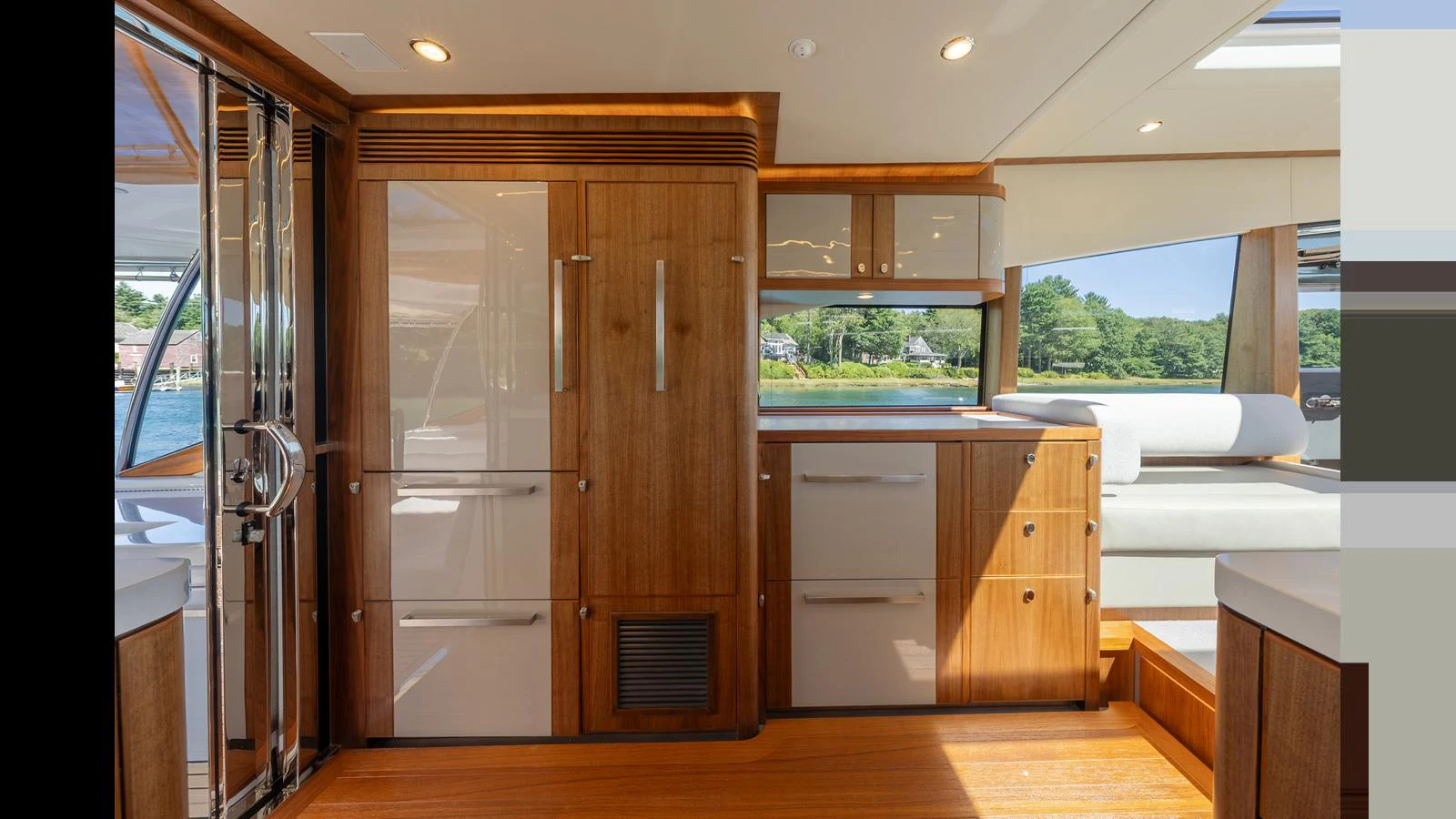 The yacht's interior features a beautifully crafted wooden cabinetry and ample natural light. aboard LYRICA Yacht for Sale