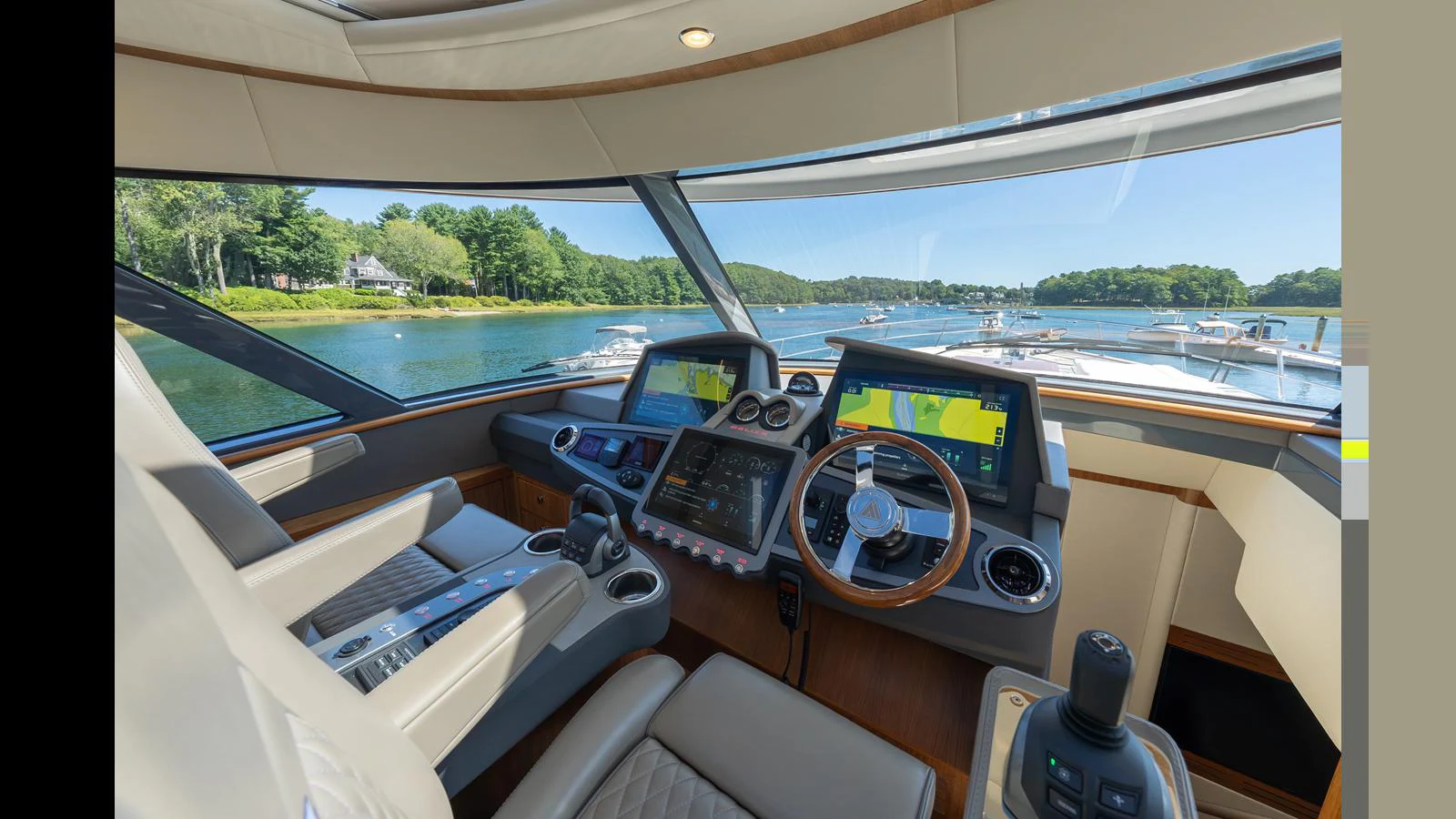 The helm station offers a commanding view with state-of-the-art navigation equipment and luxurious seating. aboard LYRICA Yacht for Sale