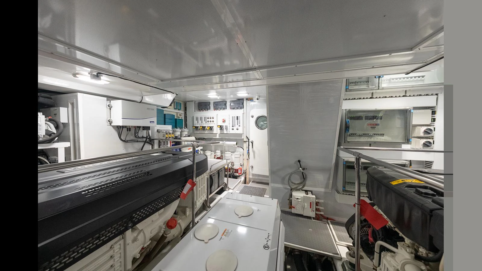 The engine room is meticulously organized, showcasing advanced machinery and control systems. aboard LYRICA Yacht for Sale