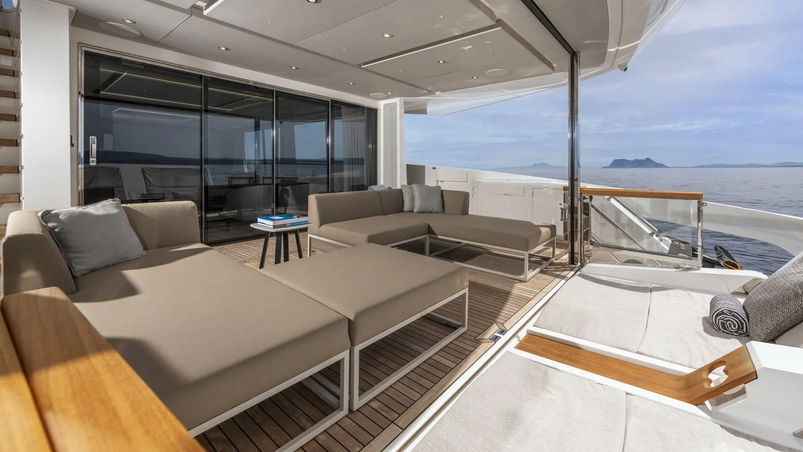 The aft deck offers a luxurious outdoor lounging area with comfortable seating and stunning sea views. aboard W OF JERSEY Yacht for Sale