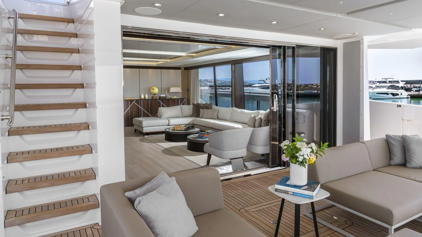 A luxurious salon with modern furnishings and a seamless indoor-outdoor transition. aboard W OF JERSEY Yacht for Sale