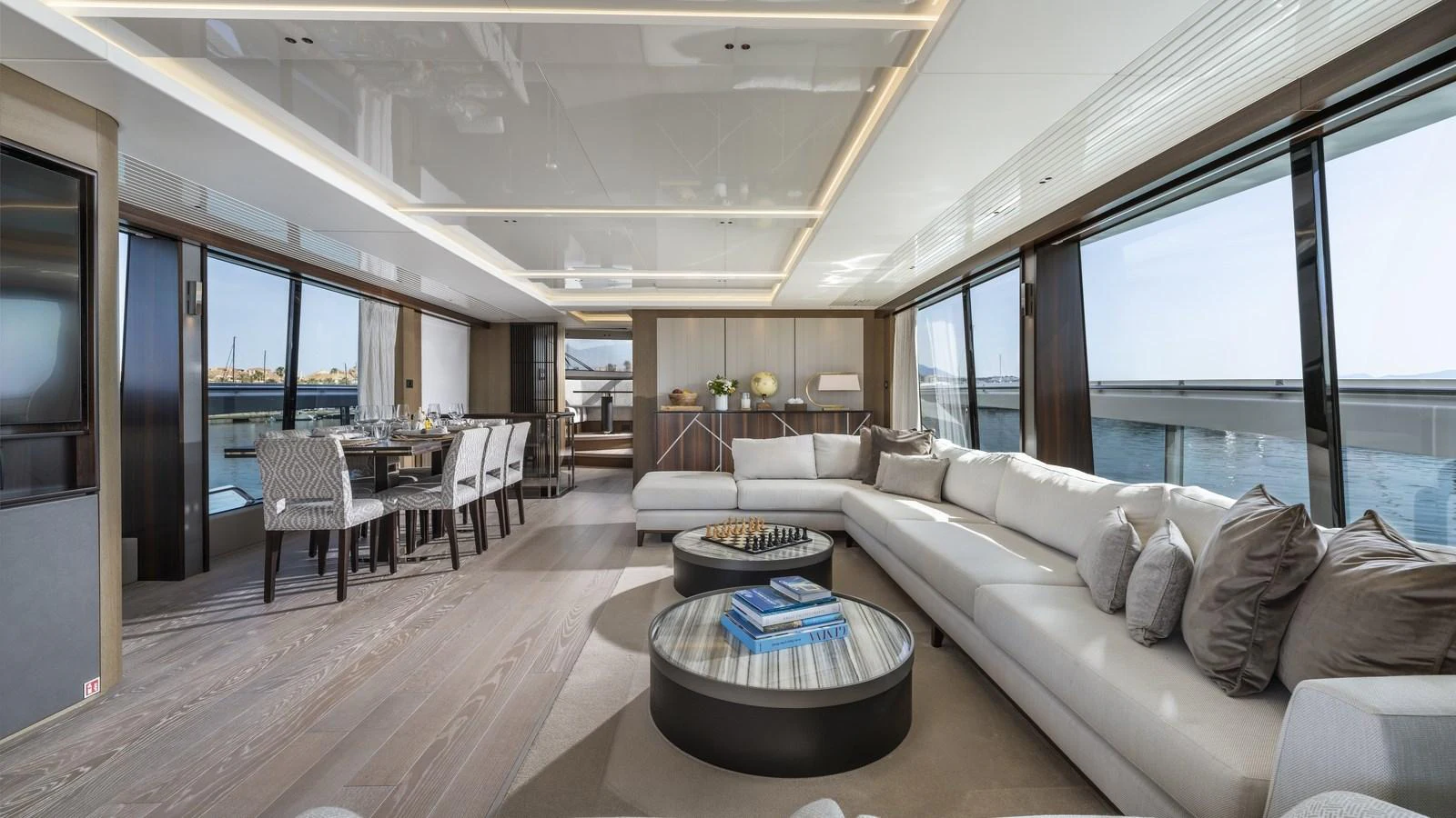 The spacious salon features elegant seating and panoramic windows offering stunning ocean views. aboard W OF JERSEY Yacht for Sale