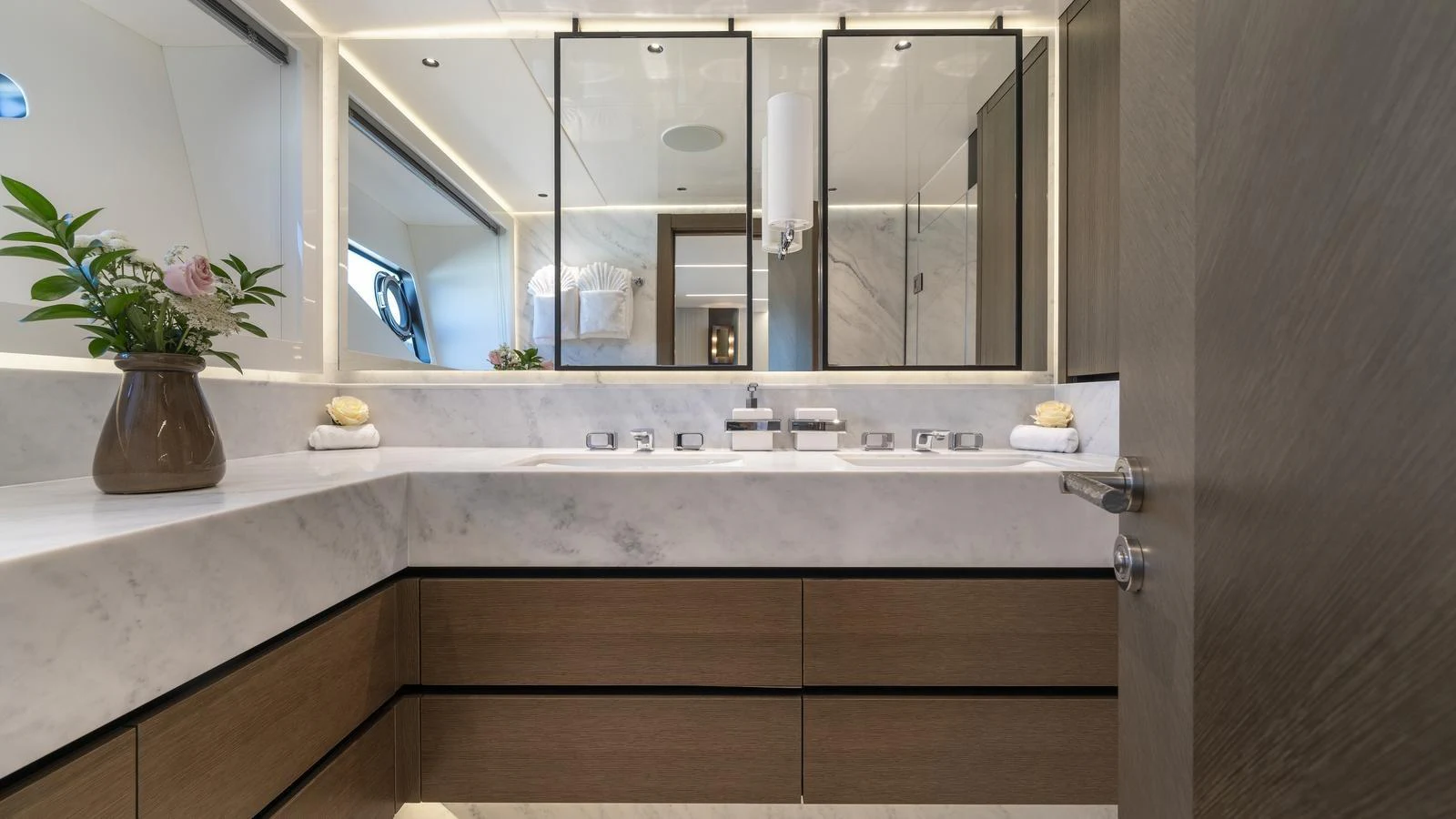 The yacht's bathroom features a sleek, modern design with marble countertops and elegant fixtures. aboard W OF JERSEY Yacht for Sale