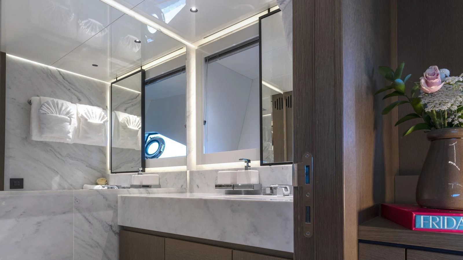 The yacht's bathroom features a luxurious marble countertop and modern fixtures. aboard W OF JERSEY Yacht for Sale