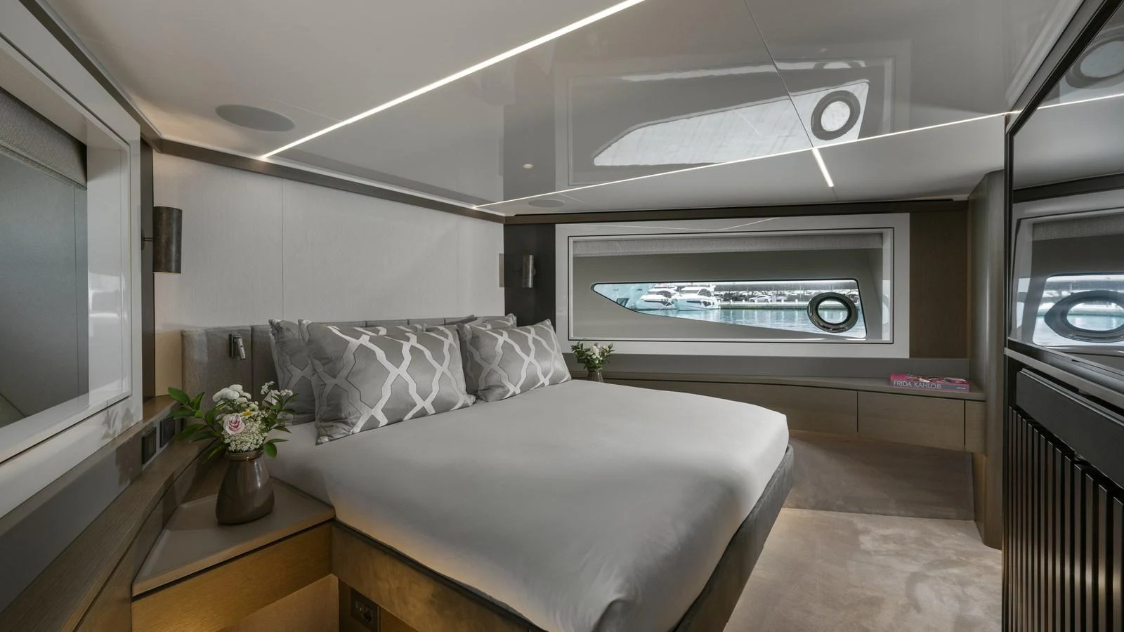A luxurious stateroom featuring a large bed with elegant bedding and modern decor. aboard W OF JERSEY Yacht for Sale