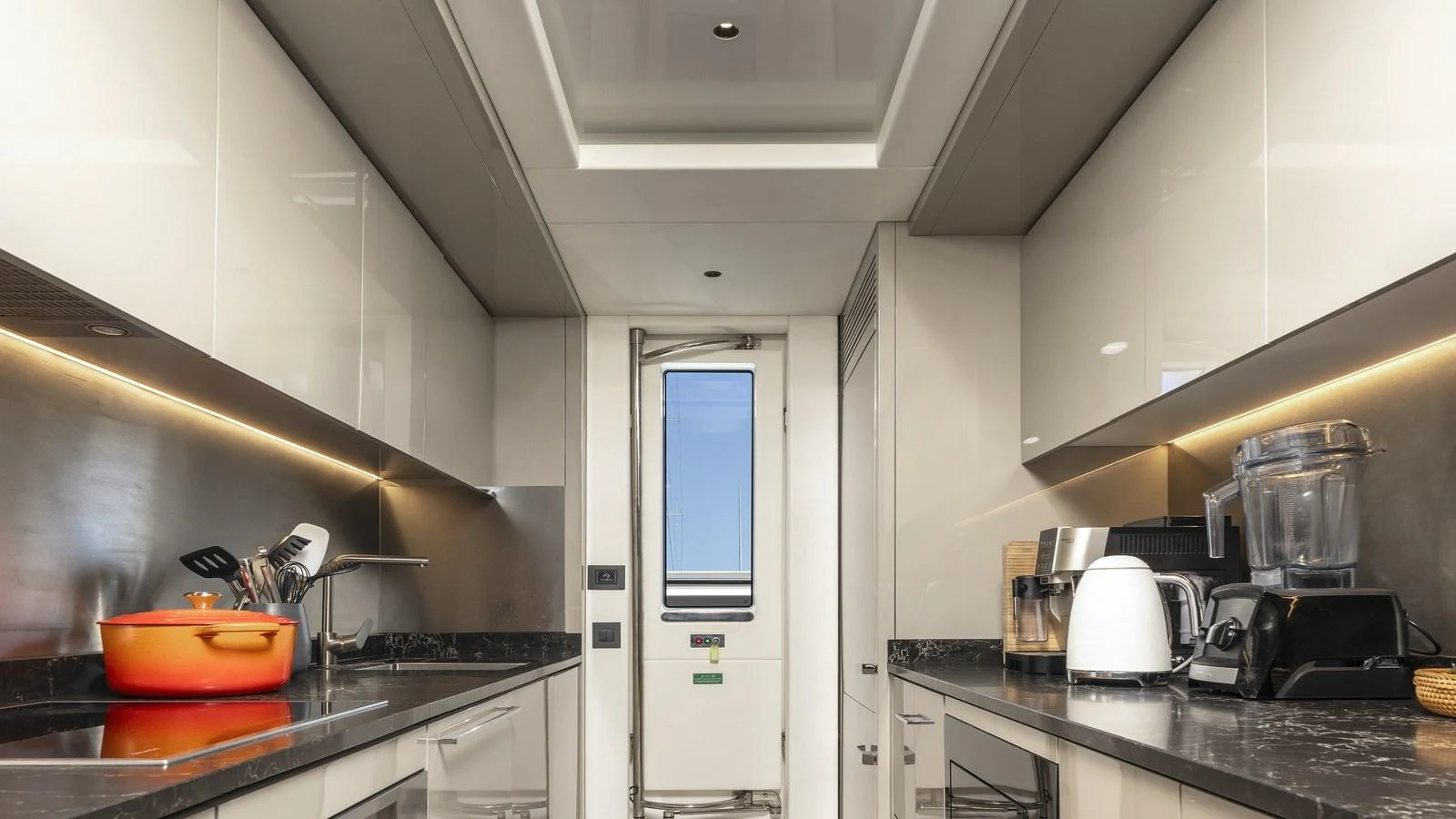 The galley is equipped with modern appliances and sleek countertops, offering a functional and stylish space for meal preparation. aboard W OF JERSEY Yacht for Sale