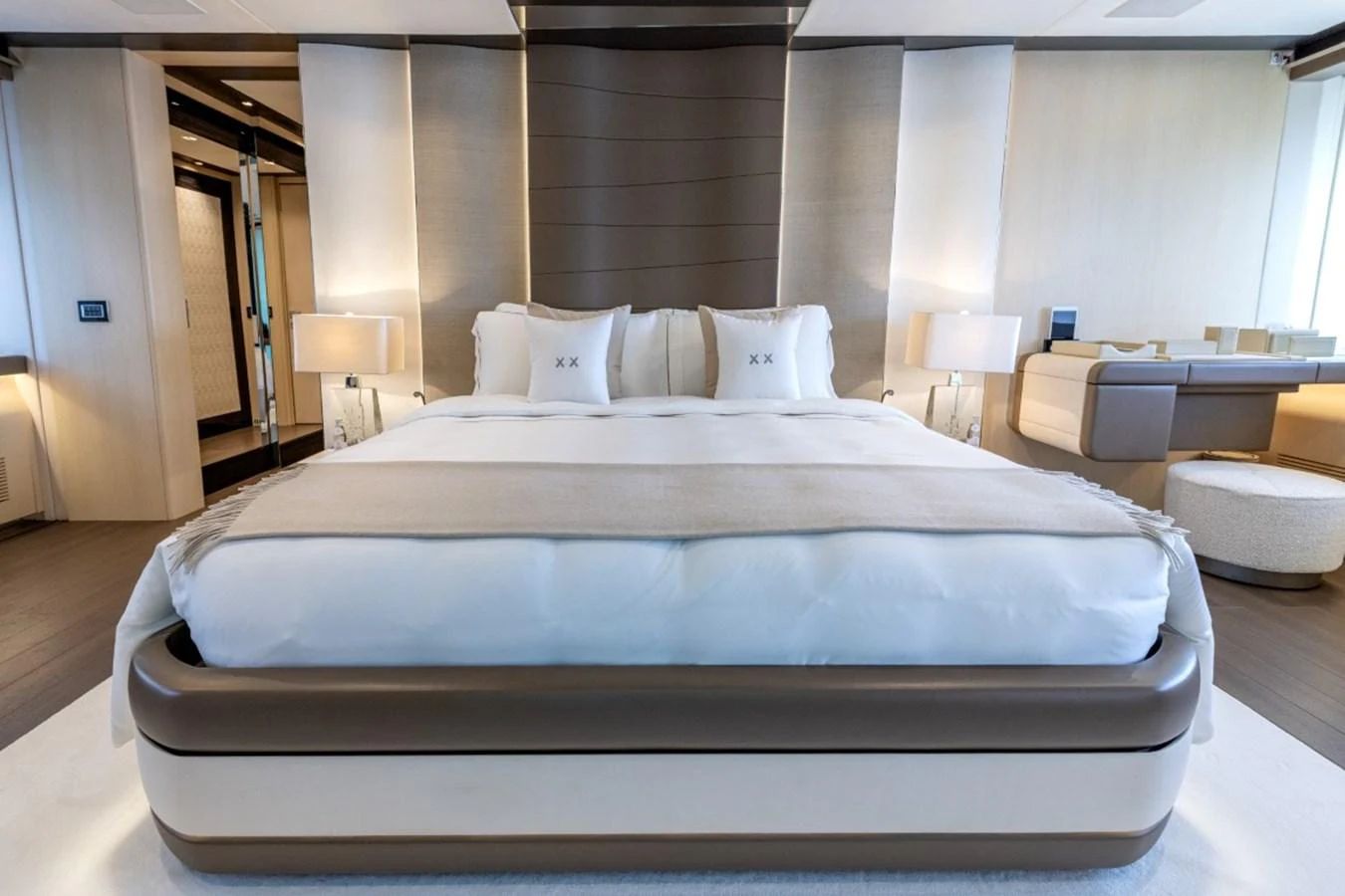 The master stateroom features a luxurious bed with elegant bedding and modern decor. aboard TOY Yacht for Sale