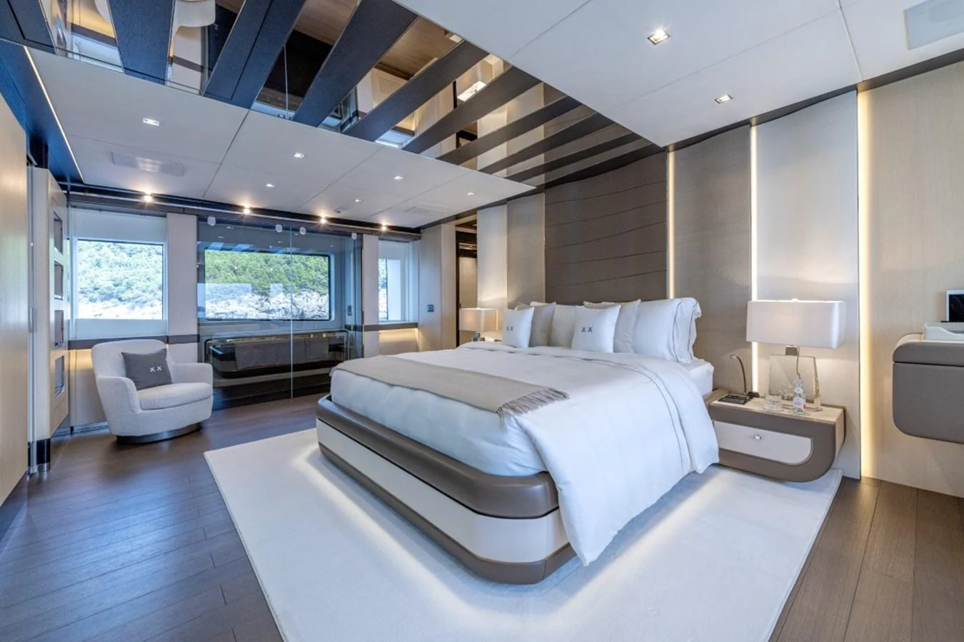 The master stateroom features a luxurious bed, modern furnishings, and ample natural light. aboard TOY Yacht for Sale