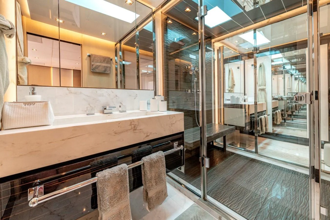 The yacht's bathroom features luxurious finishes and modern amenities, creating a serene and elegant space. aboard TOY Yacht for Sale