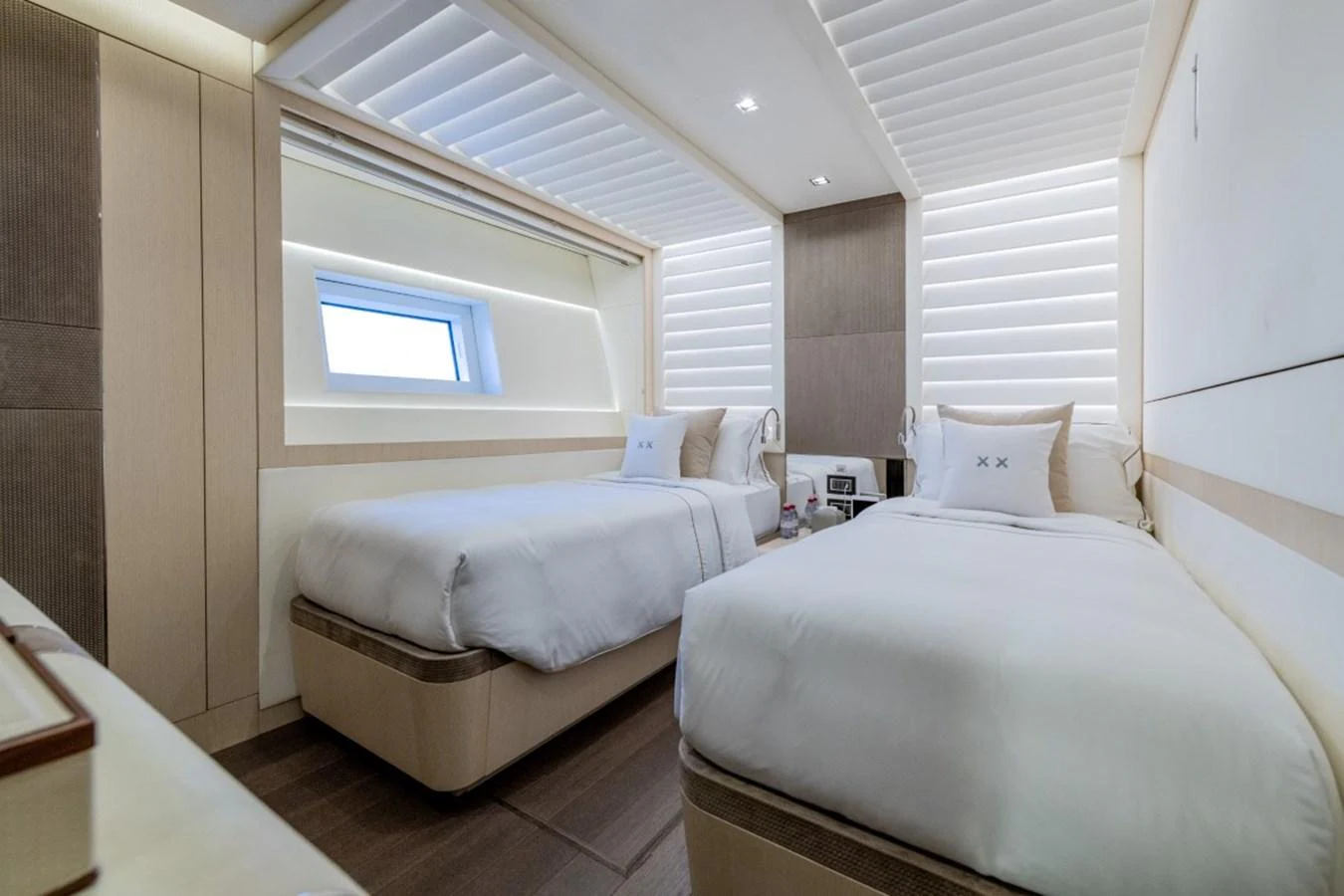 A serene guest stateroom with twin beds and modern decor. aboard TOY Yacht for Sale