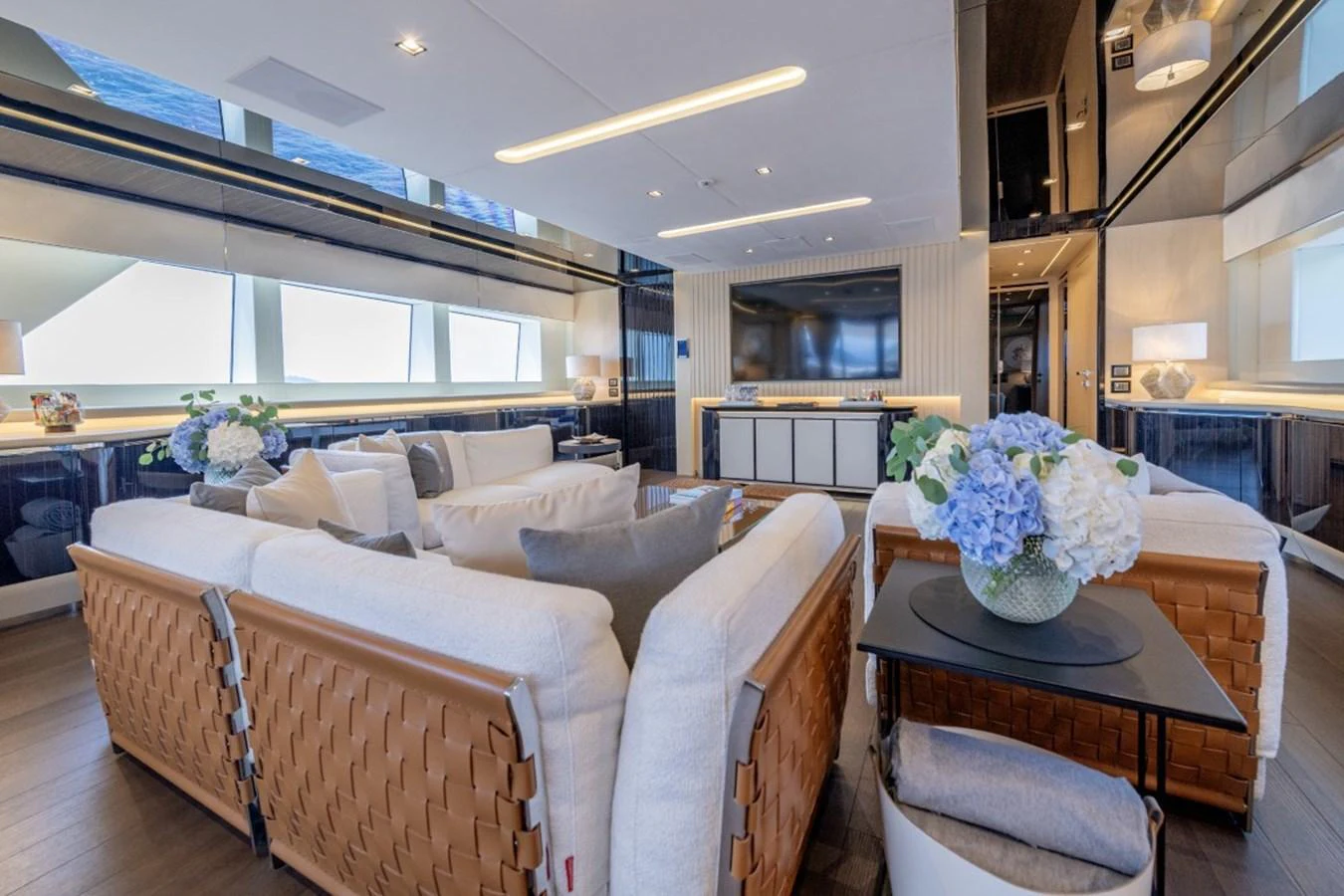 The yacht's salon features luxurious seating with elegant decor and ample natural light. aboard TOY Yacht for Sale