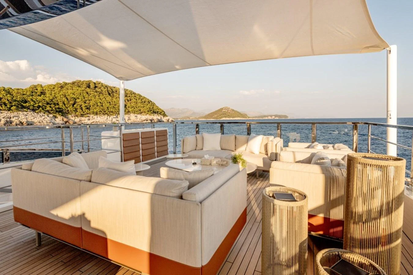 The sundeck offers a luxurious outdoor seating area with panoramic ocean views. aboard TOY Yacht for Sale