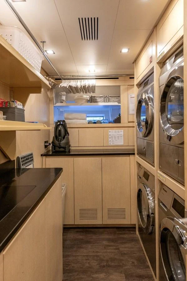The yacht's laundry room is equipped with modern appliances and ample storage space. aboard TOY Yacht for Sale