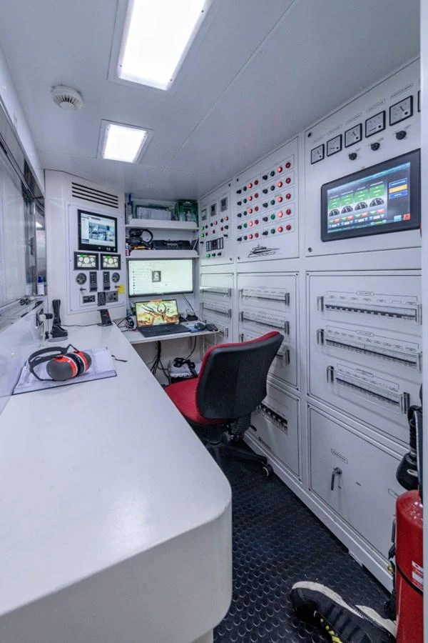 The yacht's control room is equipped with advanced monitoring systems and a comfortable workstation. aboard TOY Yacht for Sale