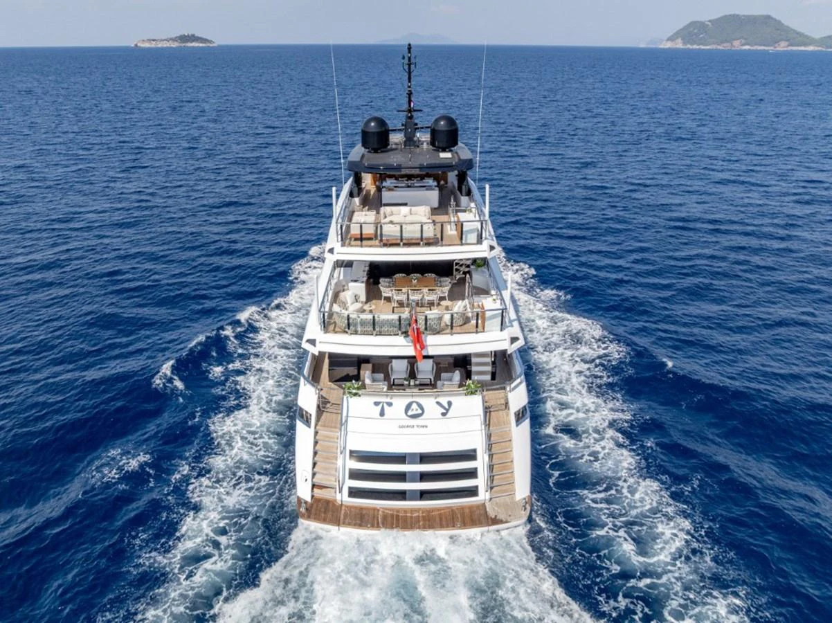 A luxurious yacht cruising through the open sea, showcasing its elegant design and spacious decks. aboard TOY Yacht for Sale