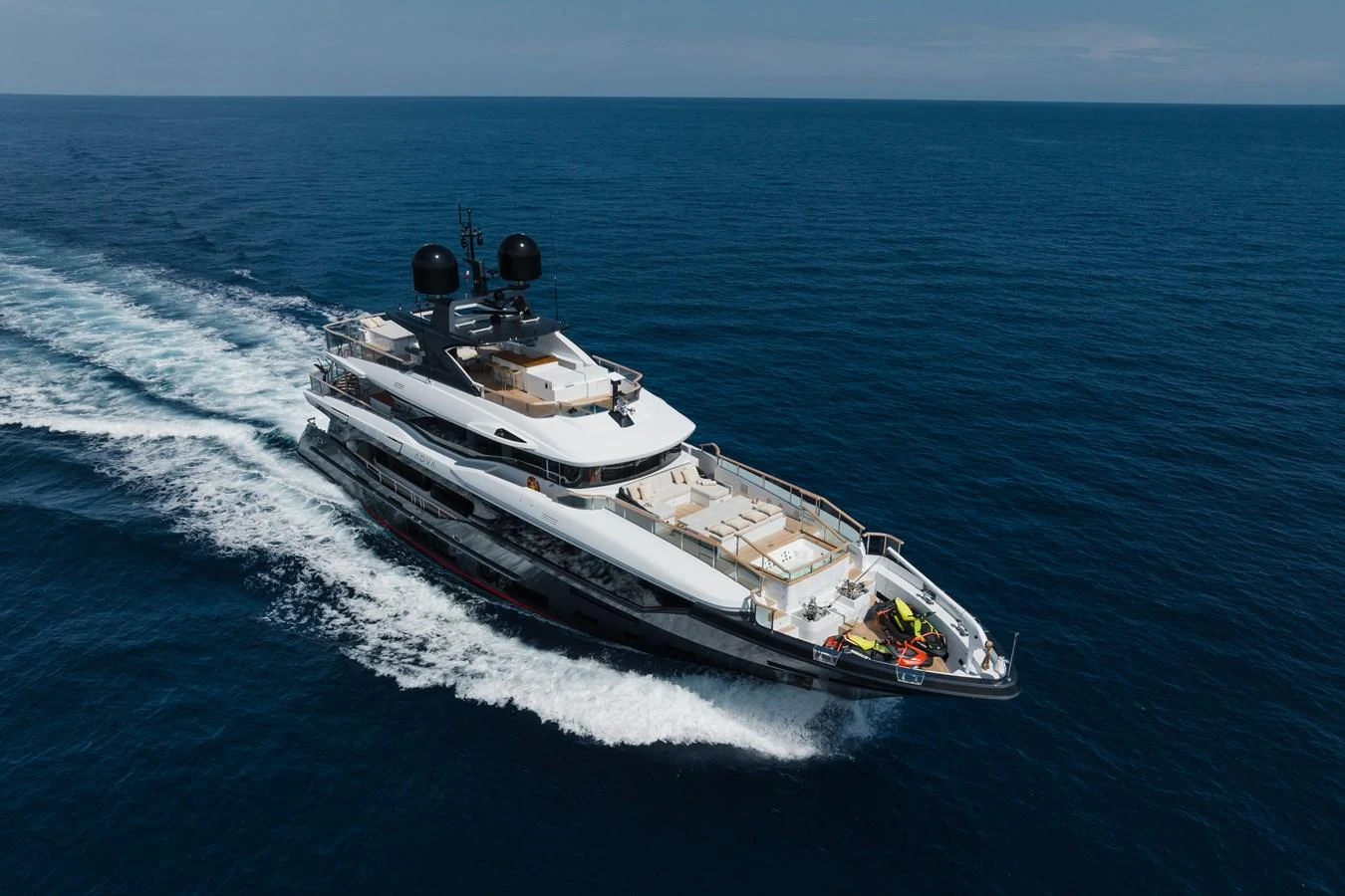 A sleek yacht cruises through the open sea, showcasing its luxurious design and spacious decks. aboard ADVA Yacht for Sale