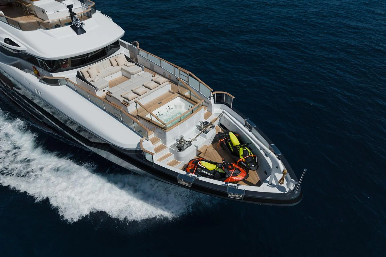 The yacht's aft deck features a luxurious seating area and a jacuzzi, complemented by water toys for added fun. aboard ADVA Yacht for Sale