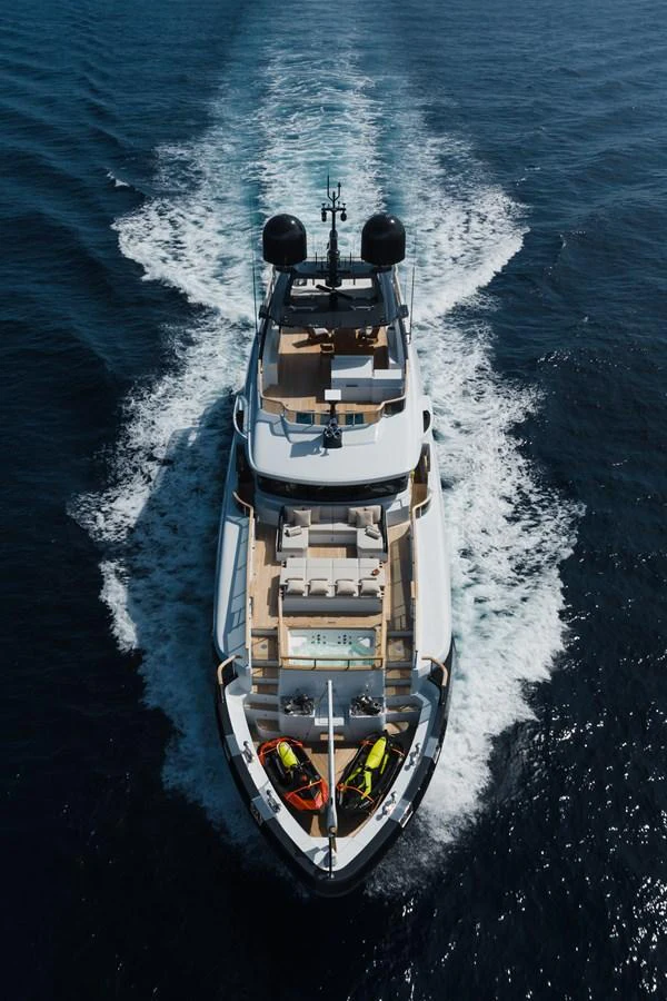 A sleek yacht cruises through the open water, showcasing its luxurious deck and amenities. aboard ADVA Yacht for Sale