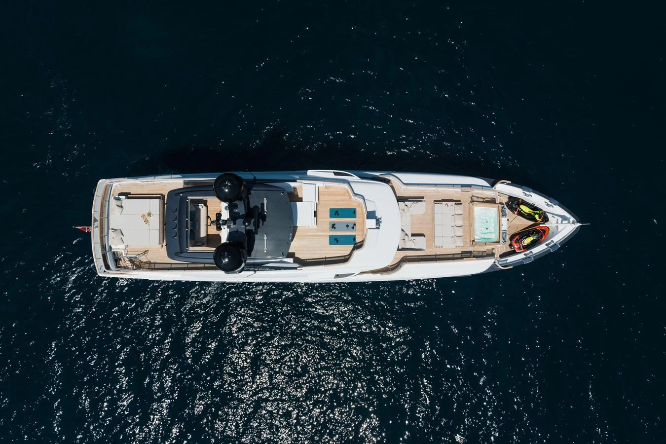 An aerial view of a luxurious yacht cruising on the open water. aboard ADVA Yacht for Sale