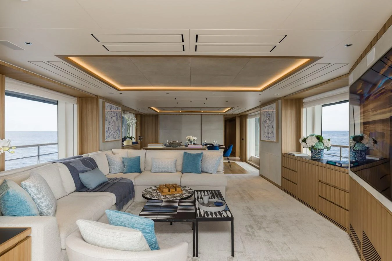 The salon features a spacious and elegantly designed seating area with panoramic views. aboard ADVA Yacht for Sale