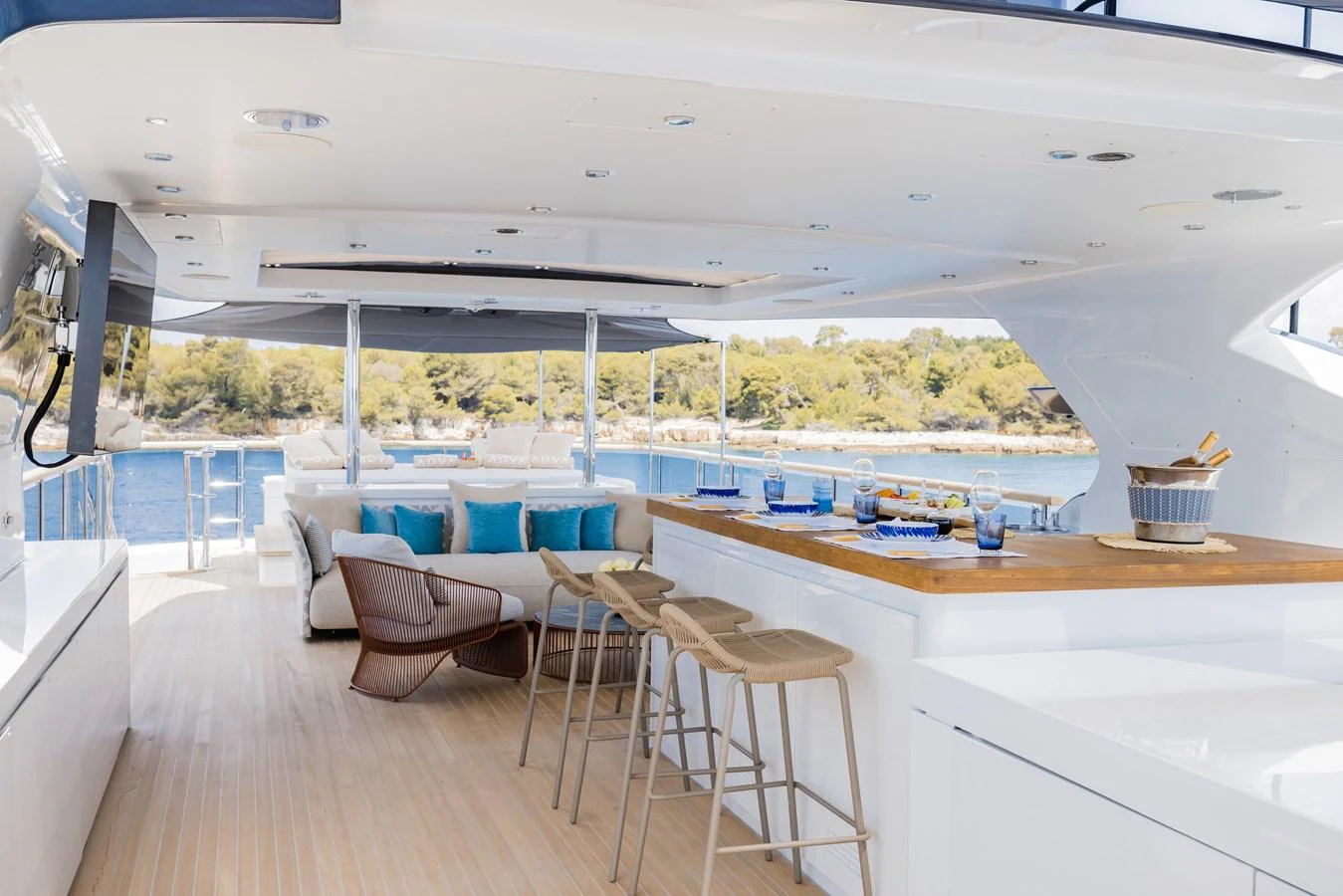 The aft deck features a stylish bar area with comfortable seating and scenic views. aboard ADVA Yacht for Sale