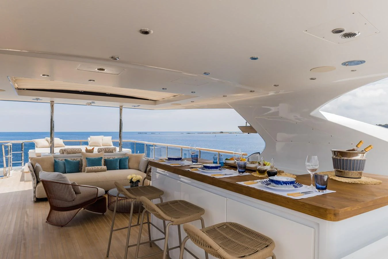 The sundeck features a luxurious bar area with comfortable seating and stunning ocean views. aboard ADVA Yacht for Sale