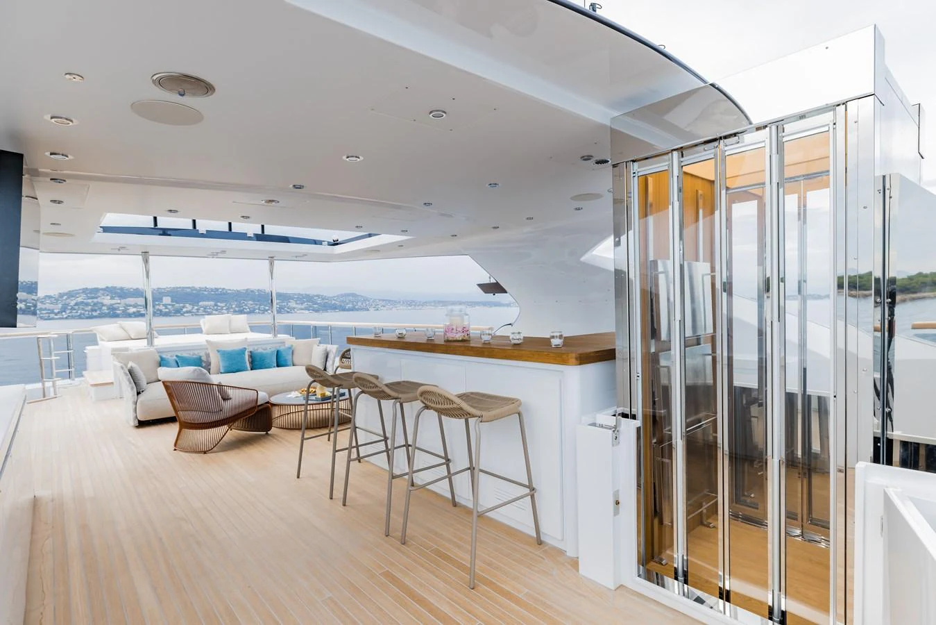 The sundeck features a stylish bar area with comfortable seating and panoramic views. aboard ADVA Yacht for Sale