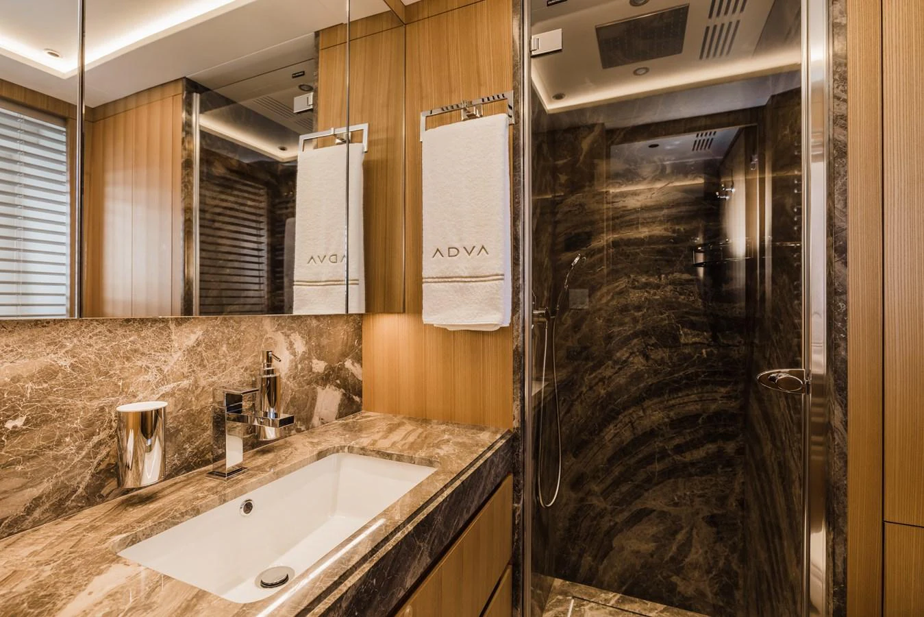 The yacht's bathroom features luxurious marble surfaces and modern fixtures. aboard ADVA Yacht for Sale