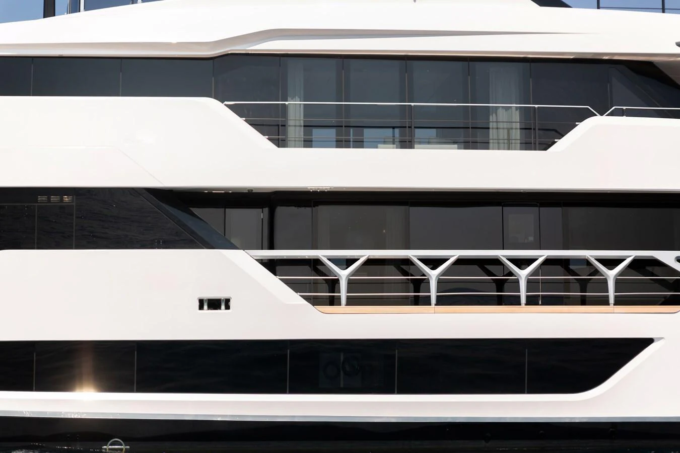 A sleek and modern yacht exterior showcasing large windows and clean lines. aboard LADY DIA Yacht for Sale